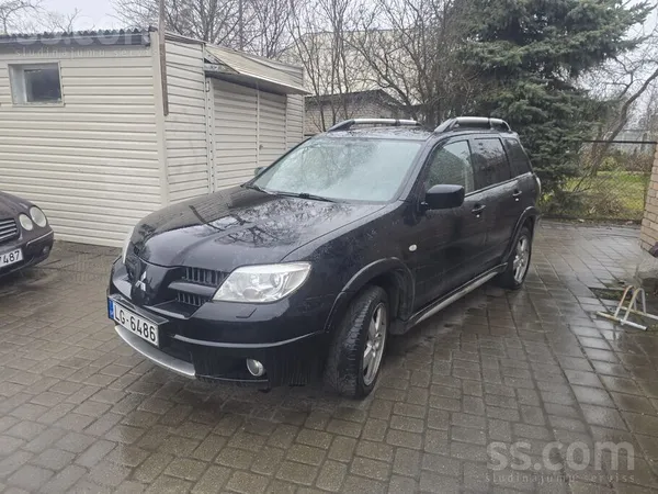 Mistubishi Outlander 2.4 benzīns 118kw 2006 automāts. TA 10.2026. Auto labā